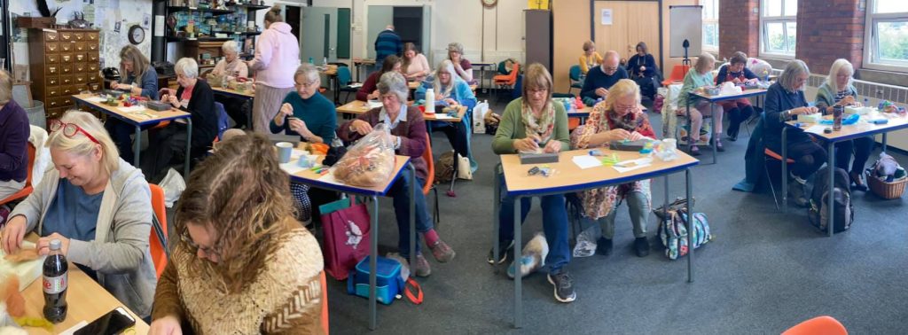 Members making felt badges