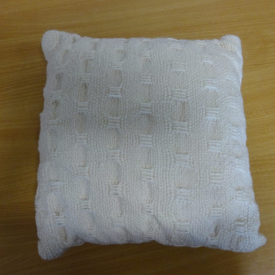 White woven cushion.