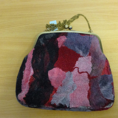 A bag in various shades of red