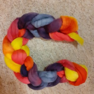 A multi-coloured hank of dyed fiber.