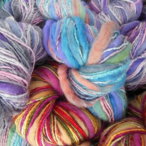 Closeup view of various multi-coloured handspun fancy yarns